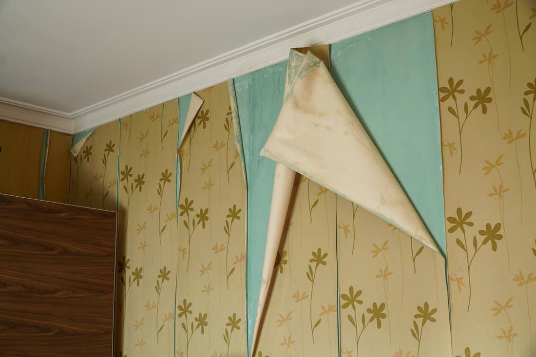Open wallpaper seam on damp walls, peeling wallpaper seam repair