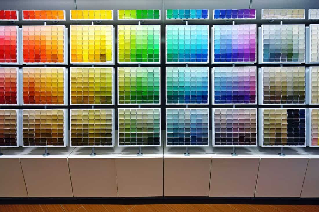  Paint color swatches on display in a Sherwin-Williams painting store.