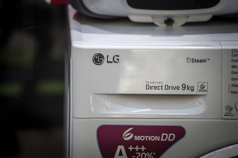 Selective blur on the LG Electronics logo on a washing machine, How To Use Delay Wash On My LG Washer [Step By Step Instructions]