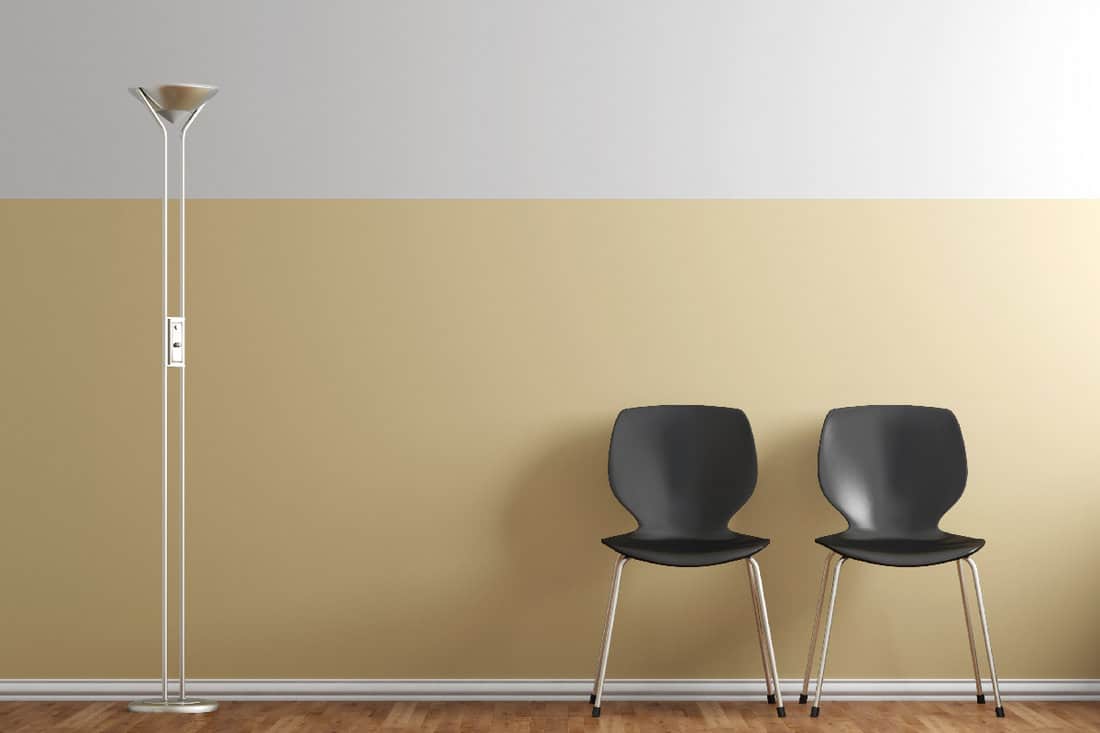 Waiting room with chairs and lamp beige wall