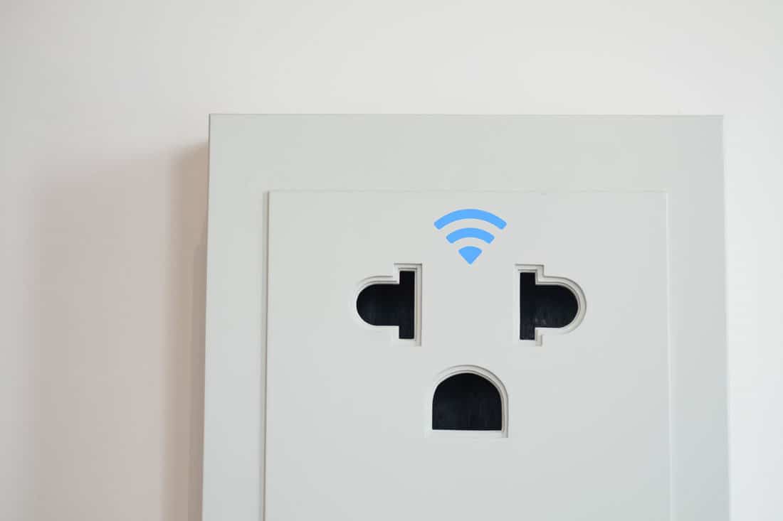 White Wifi Smart Outlet on the wall
