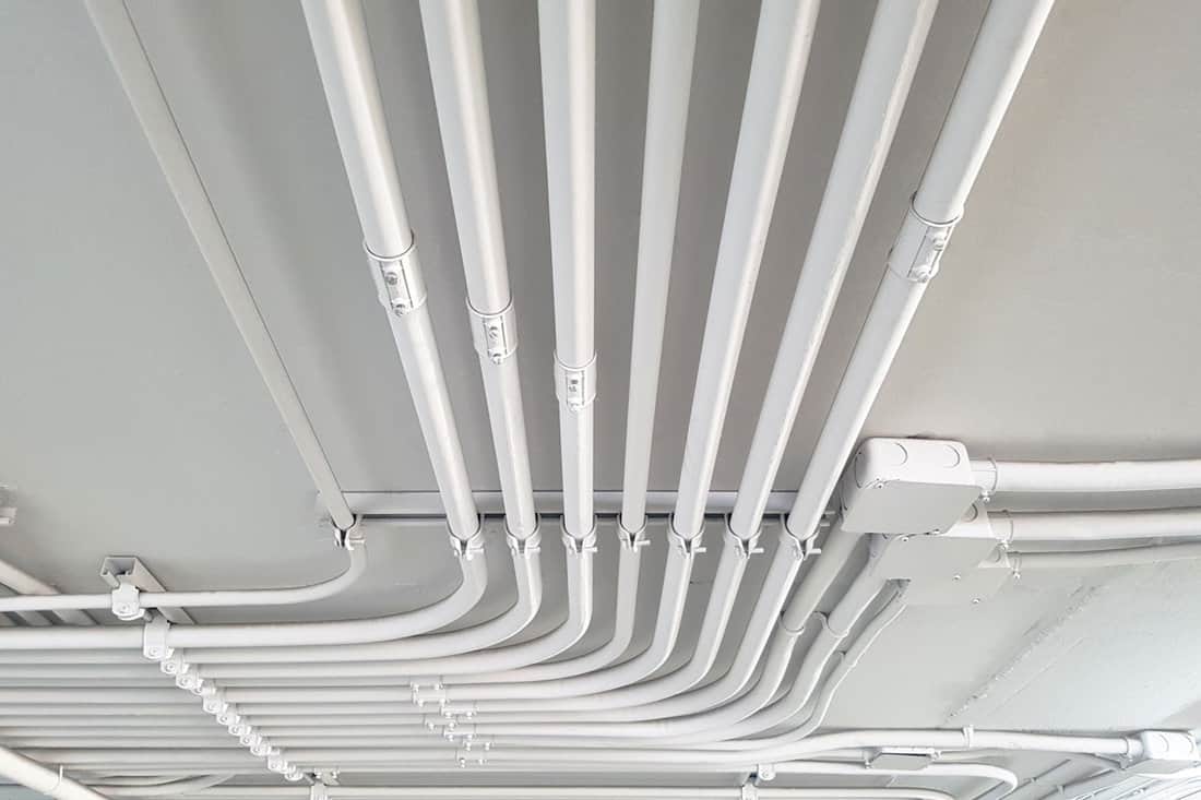 White electric PVC pipes line or Wiring rails in the building