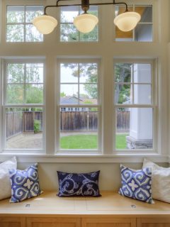 Window Seat with a view to the yard and large windows. - How To Dress A Wide Short Window [Inc. Pictures For Inspiration]
