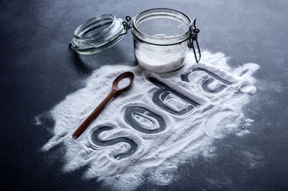 baking soda scattered from a glass jar