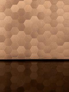 close-on-elegant-golden-hexagonal-wall, What Color Goes With Copper For Walls, Trim, & Accents? [X Color Ideas You Will Love!]