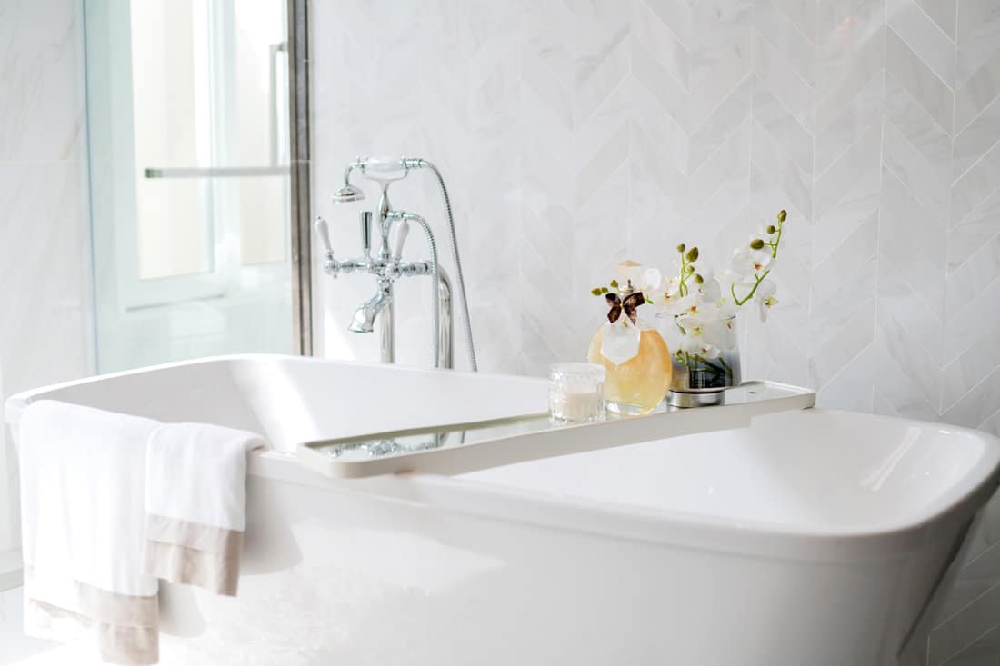 close up chrome faucet shower bath tub room interior design