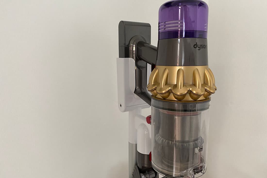 closed up view of Dyson V11 in gold colour vacuum hang at a dock