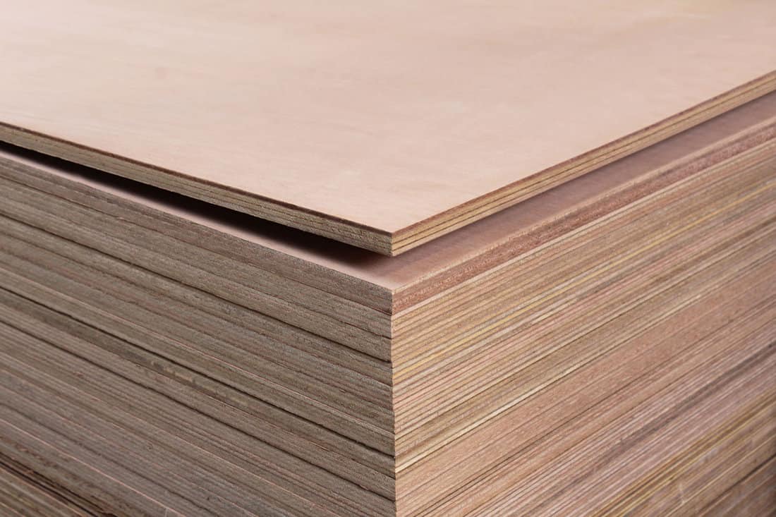 closeup-stacked-wooden-boards-furniture, Kerdi-Board-Vs-Cement-Board-Uses,-Differences,-&-Considerations-For-Your-Project