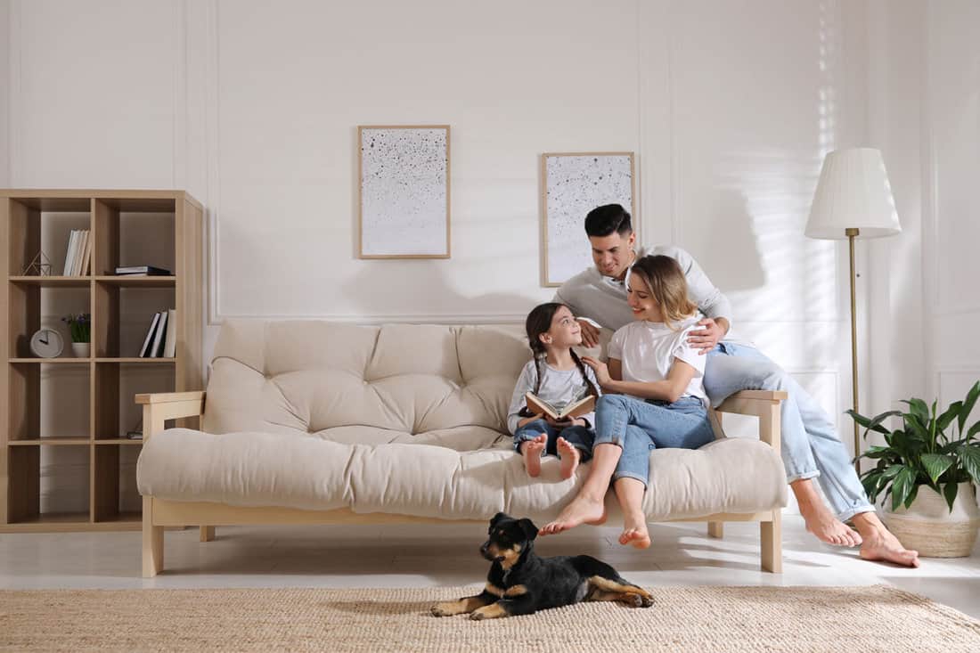 happy-family-on-sofa-puppy-living