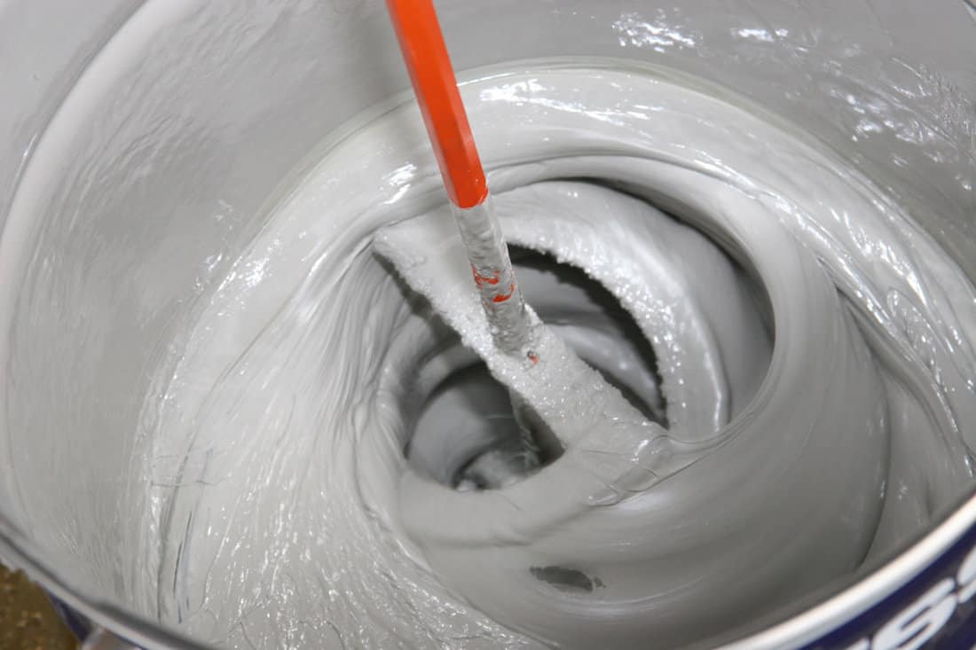 mixing-epoxy on the huge bucket