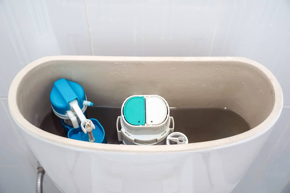 open toilet tank,repair toilet toilet tank that drains water, old toilet,Water valve mechanism