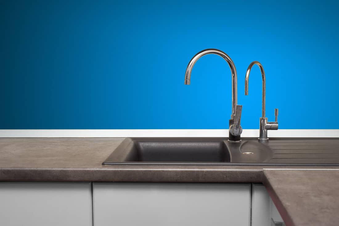 stainless steel sink and faucet in kitchen