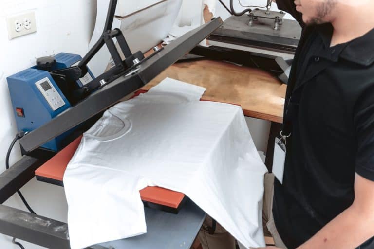 unrecognizable-person-working-on-iron-sublimation, Can You Use An Iron Instead Of A Heat Press?