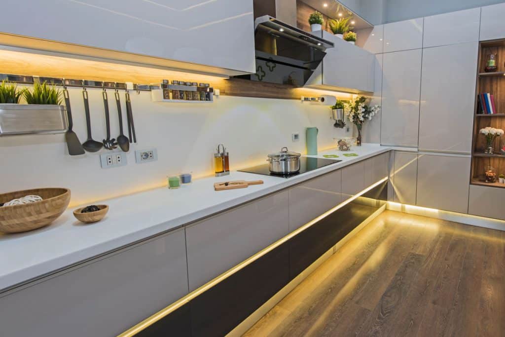 A gorgeous modern long span kitchen with yellow flourescent light