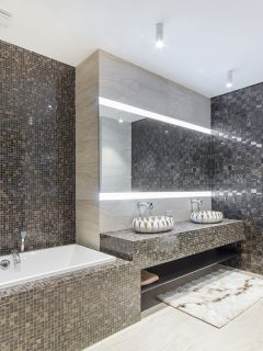 A huge bathroom with a vanity top with two bowls and a wide mirror with lights, Types Of Shower Wall Materials With Pros & Cons: Which To Choose?