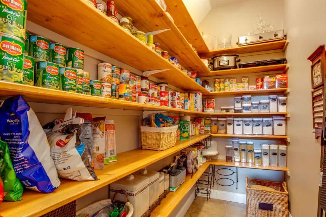 A well stocked large pantry with canned goods for the coronavirus