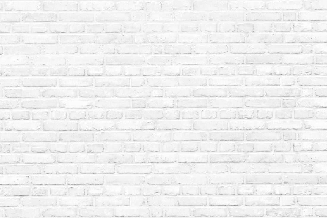 Background of a white brick old wall. Clear white brick wall texture. 