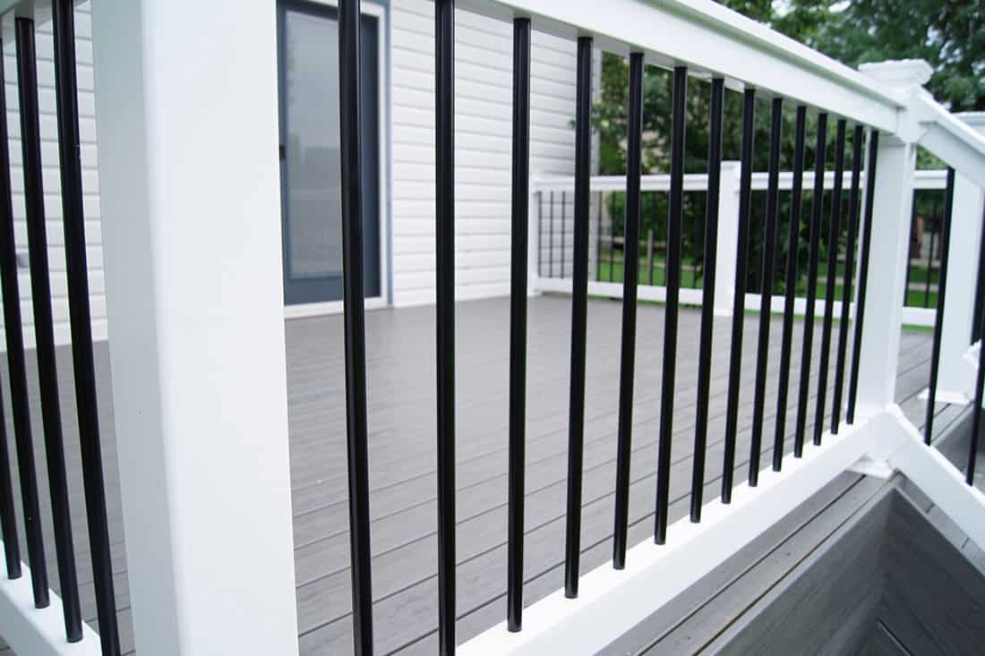 Backyard composite deck rail close up