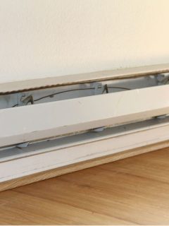 Baseboard Heater White Wall and Wood Floor