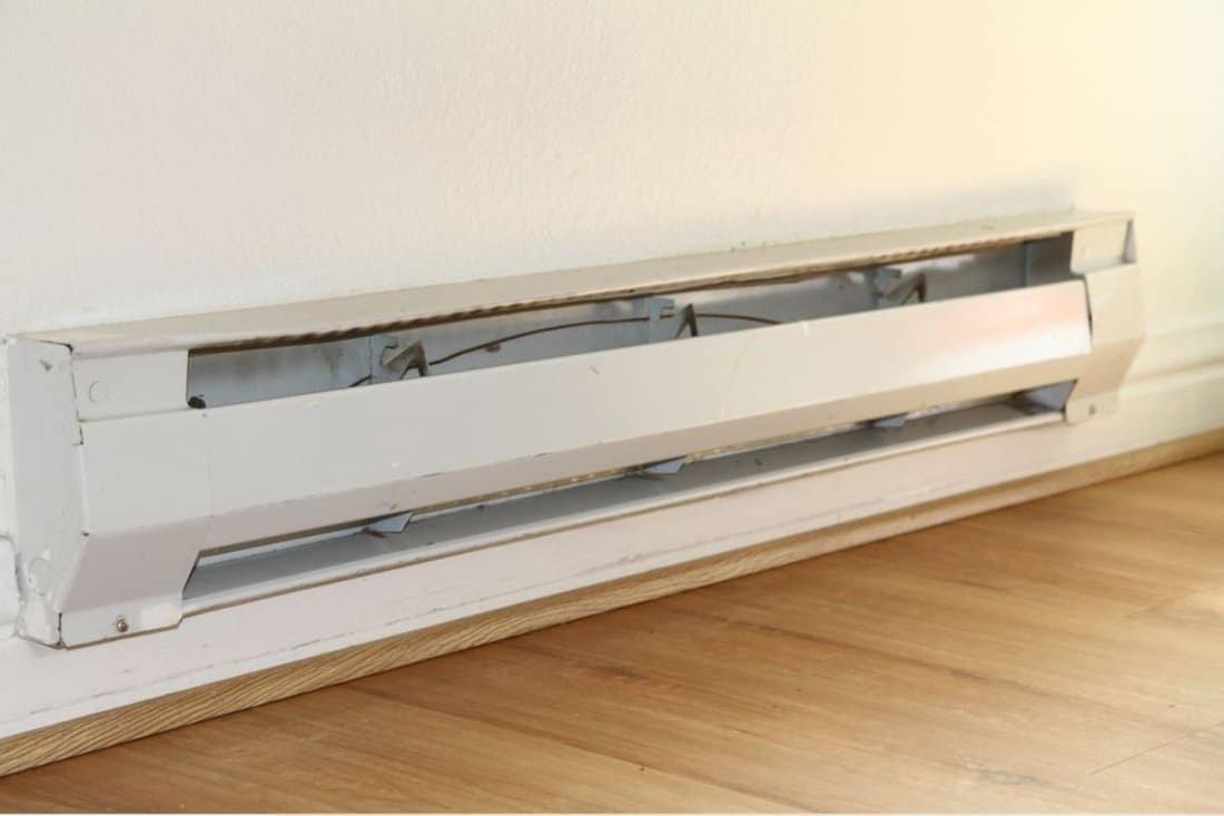 Baseboard Heater White Wall and Wood Floor