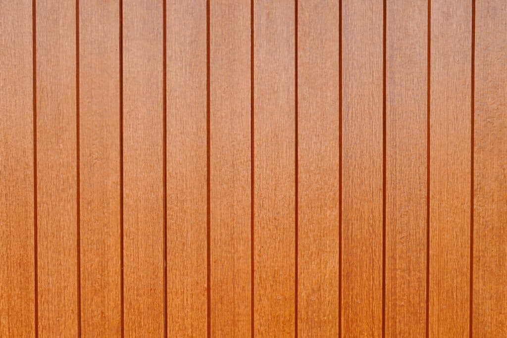 Brown board and batten siding photographed up close