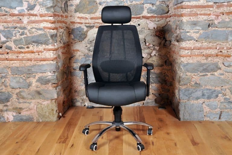 Comfortable and stylishly designed black office chair in front of a wall, How To Replace Ball Bearings In A Swivel Chair [Step By Step Guide]