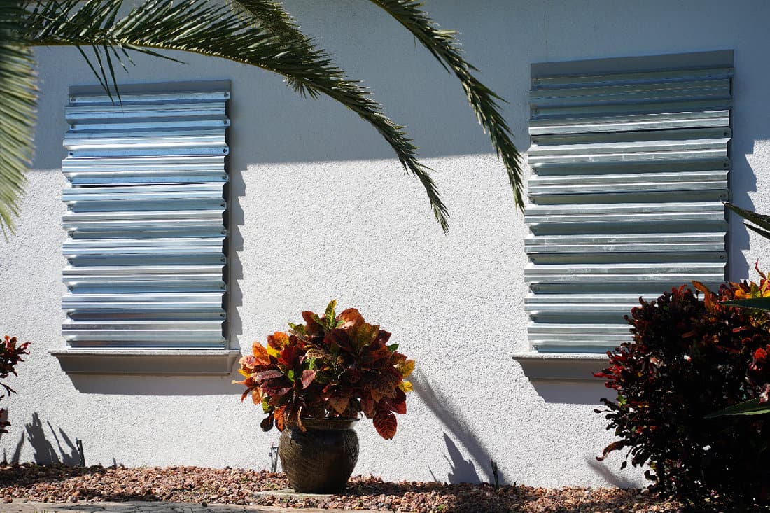 Home prepares for hurricane by putting up storm shutters