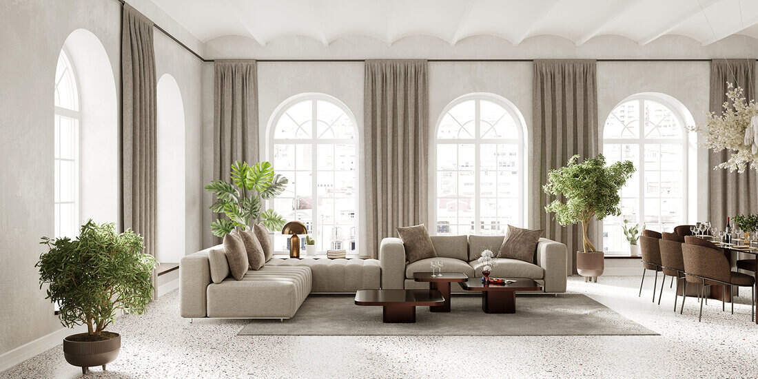 Large living room with arch windows, furnished with modern sofa and dining table