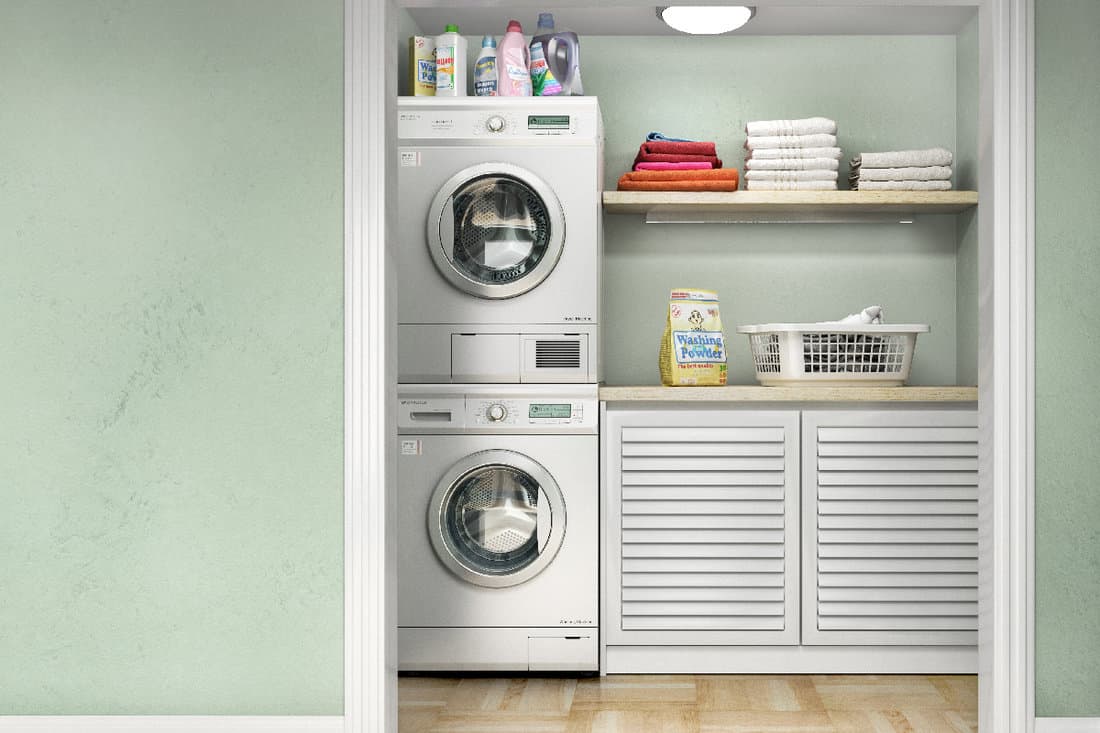 Laundry room with wood floor, washing machine at closet,