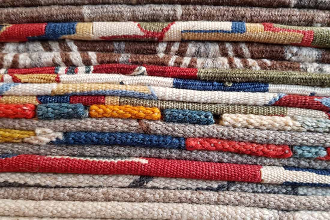 Layers of colorful weaved carpets