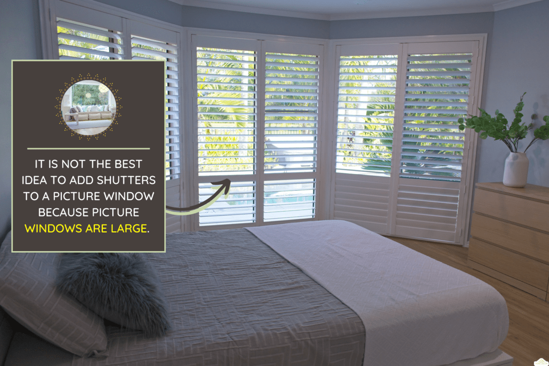 Luxury white indoor plantation shutters in bedroom - selective focus - Should You Put Shutters On A Picture Window