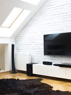 Modern apartment with home theater, How To Calibrate Home Theater Speakers [Step By Step Guide]