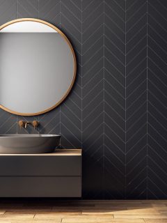 Modern black bathroom interior with decorative tree, sink and round mirror, How To Get Scratches Out Of A Bathroom Mirror [6 Ways To Try!]