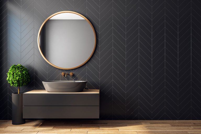 Modern black bathroom interior with decorative tree, sink and round mirror, How To Get Scratches Out Of A Bathroom Mirror [6 Ways To Try!]