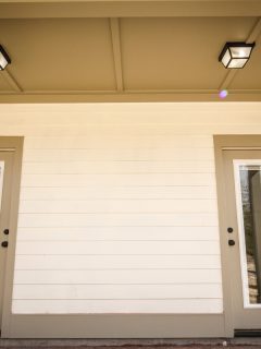 Modern new Construction Back Porch with Two Glass Doors, Do You Need To Prime Hardie Siding Before Painting?