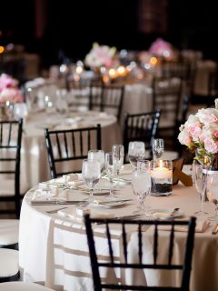 Multiple tables with centerpieces at an indoor elegant wedding reception - How Wide Should A Centerpiece Be