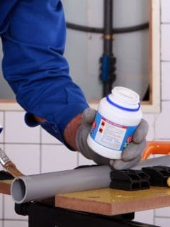 Plumber applying primer on a pvc, Do You Need To Prime Pvc Before Painting?