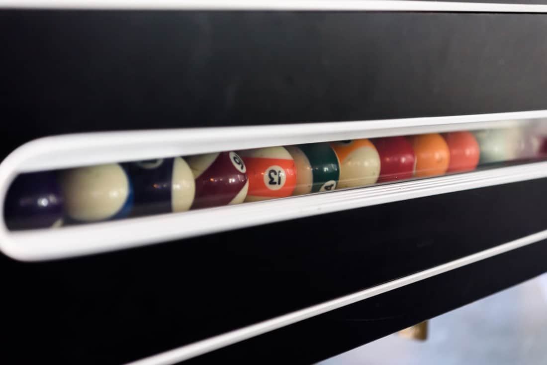Pool or billiard balls inside the coin operated pool table slot