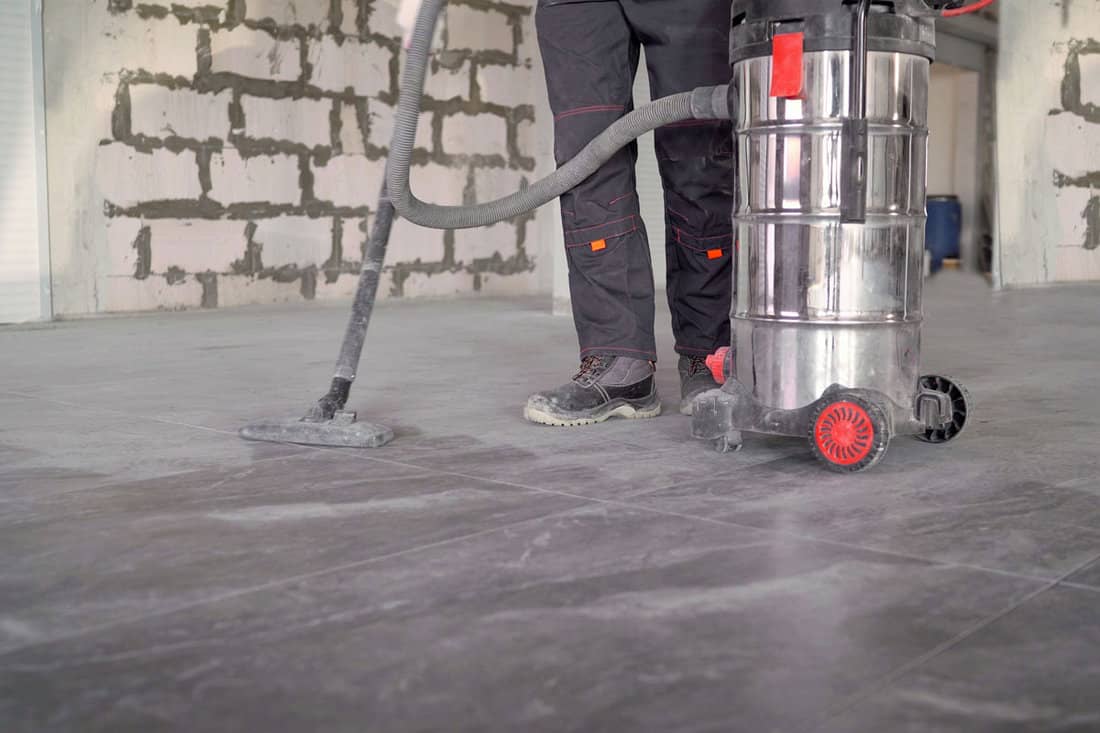 Professional cleaning of the premises after renovation with industrial vacuum cleaner