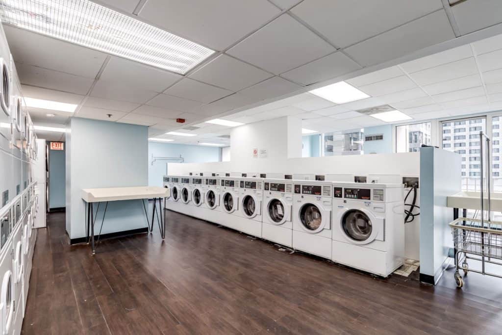 Rows and rows of Speed Queen washing machines inside an apartment building, How To Force Drain A Speed Queen Washer