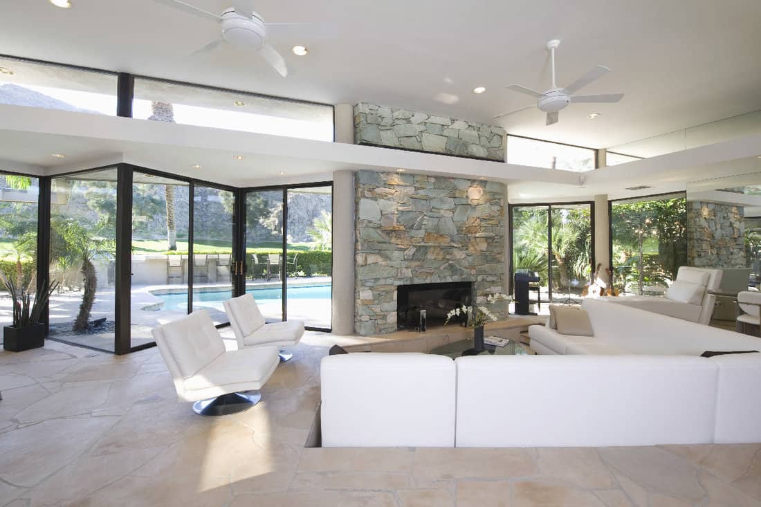 Seating area and stone fireplace in spacious living room