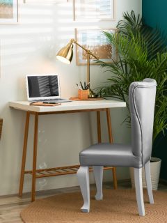 Stylish home workplace with elegant grey chair near window. Interior design - Can You Put Legs On A Swivel Chair [Yes! Here's How!]