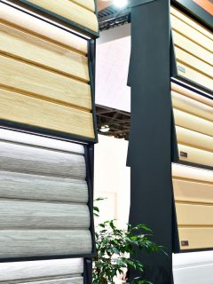 Vinyl siding on display in store, How Much Siding Is In A Square?
