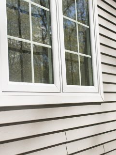 Vinyl siding on house with window frames, My Vinyl Siding Won't Snap Together - Why? What To Do?