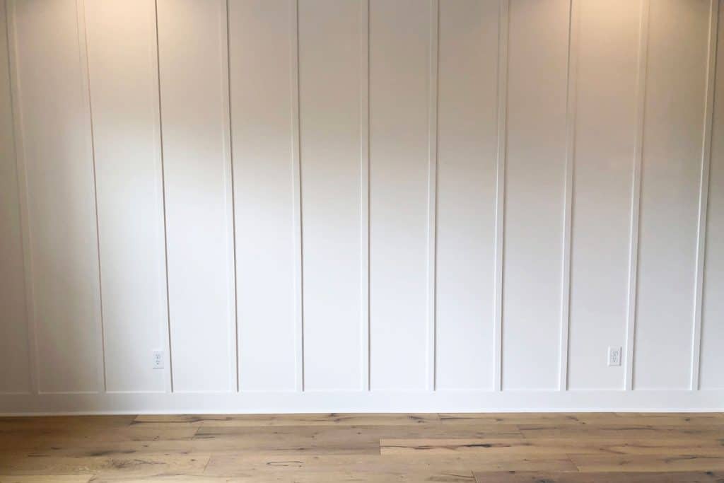 White board and batten siding with laminated flooring