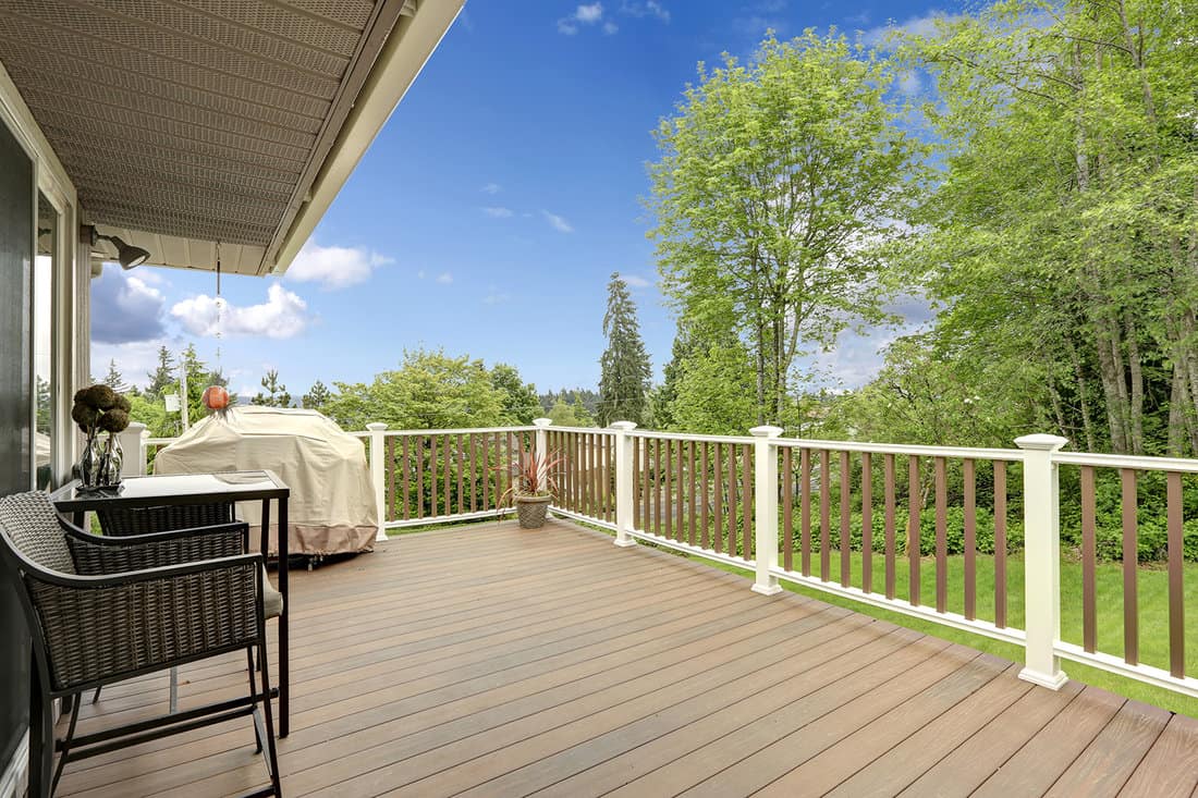 Wooden deck with white and brown railings