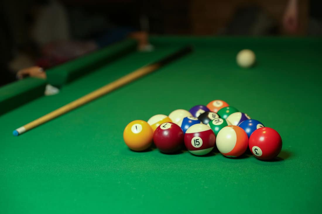 billiard cues pyramid multicolored pool balls