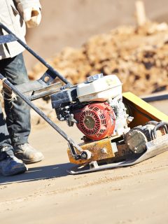 builder worker sand ground compaction vibration, Can You Pour Concrete Over Dirt?