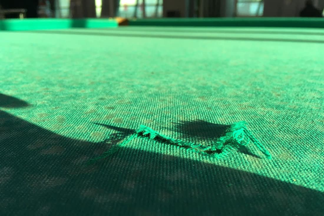 damage pool table torn cloth on bad players