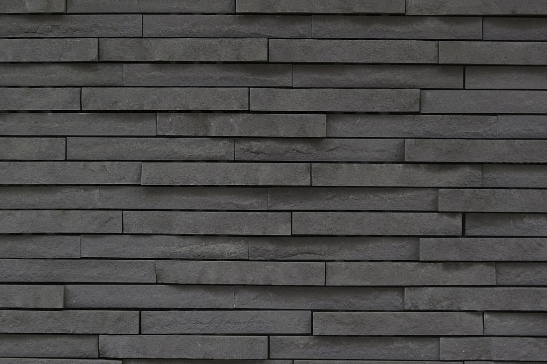 dark grey stone tile texture brick wall surfaced 